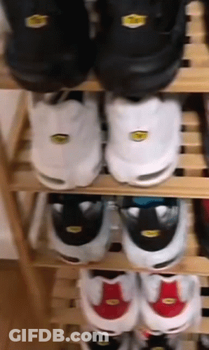 Stack Of Shoes On Shelf GIF