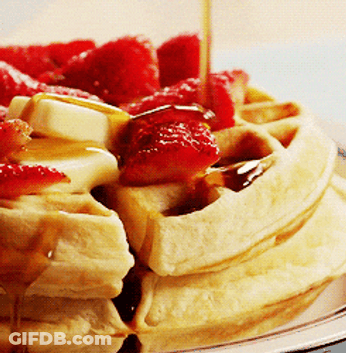 Stack Of Waffles With Honey And Strawberries GIF