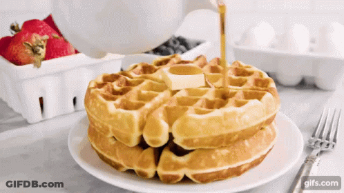 Stack Of Waffles With Syrup Being Poured GIF