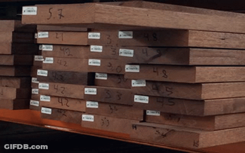 Stack Of Wood With Number 57 GIF