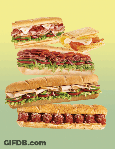 Stacked Sub Sandwiches On Green And Yellow GIF
