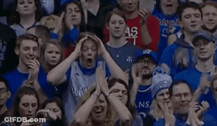Stadium Crowd Watching Game, One Holding Head GIF