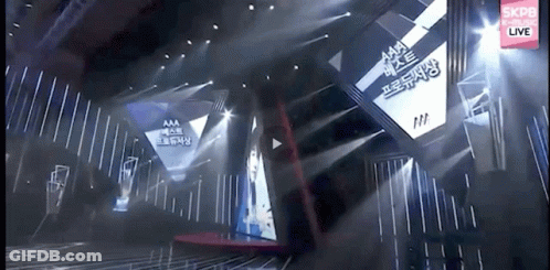 Stage With Large Screen Saying Aaa GIF