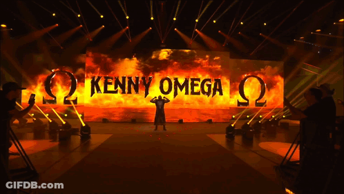 Stage With Large Screen Saying Kenny Omega GIF