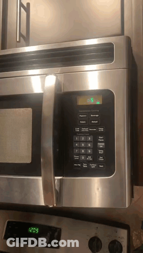 Stainless Steel Microwave Oven Set To 3:28 GIF
