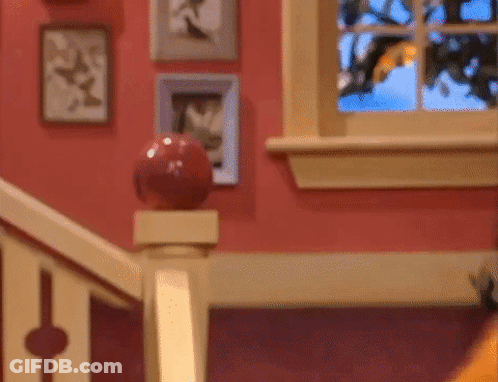 Staircase With Red Ball On Railing And Window GIF