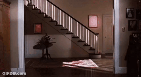 Staircase With Table And Wall Pictures GIF