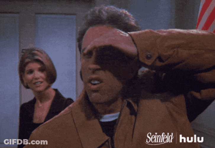 Stalking Jerry Seinfeld Shielding Eyes GIF