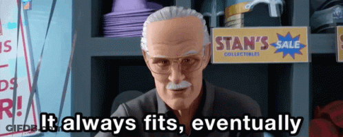 Stan Lee Says It Always Fits Eventually In Front Of A Sign For Stan 'S Sale Collectibles GIF
