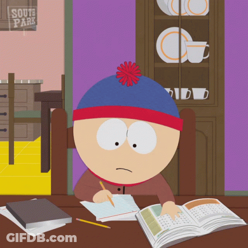 Stan Marsh From South Park Sits At A Desk With A Book GIF