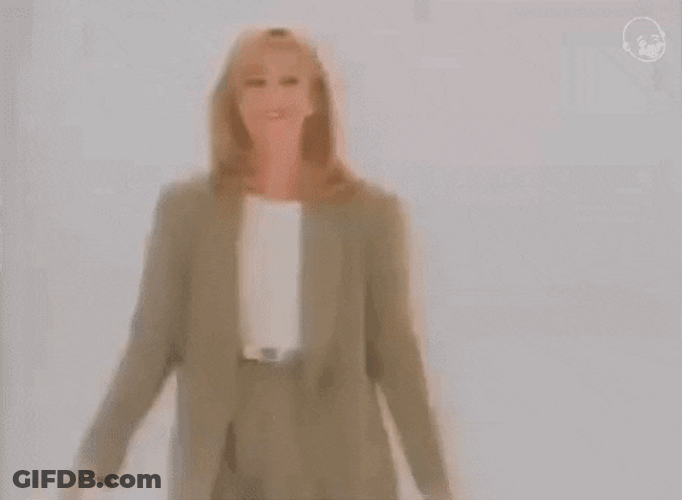 Stand Up Woman In Formal Outfit GIF