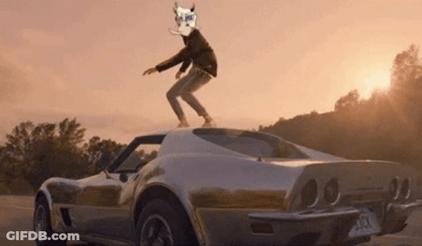 Standing Above The Running Race Car GIF