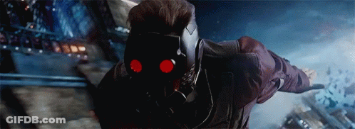 Star Lord From Guardians Of The Galaxy Is Wearing A Helmet With Red Eyes And Is Flying Through The Air . GIF