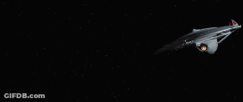 Star Trek Ship Flying With Large Orange Eye GIF