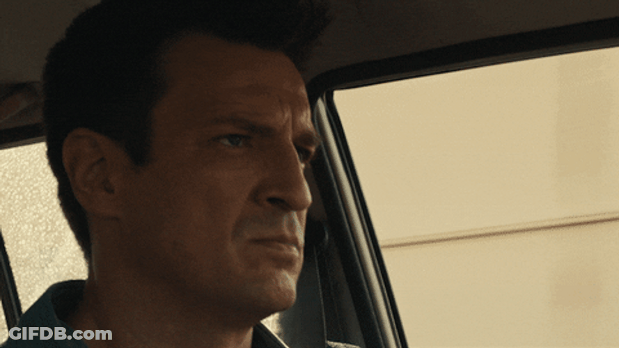 Stare Down Nathan Fillion Intense Face GIF