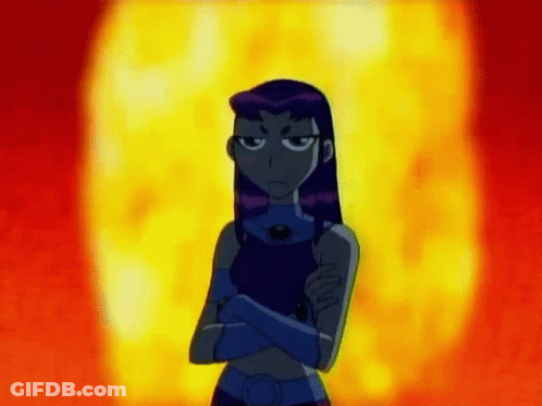 Starfire From The Teen Titans Go Is Standing In Front Of A Fireball With Her Arms Crossed . GIF