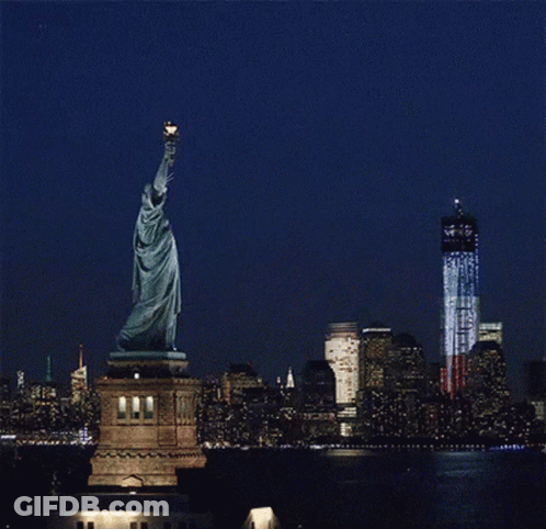 Statue Of Liberty Foreground Twin Towers Background GIF