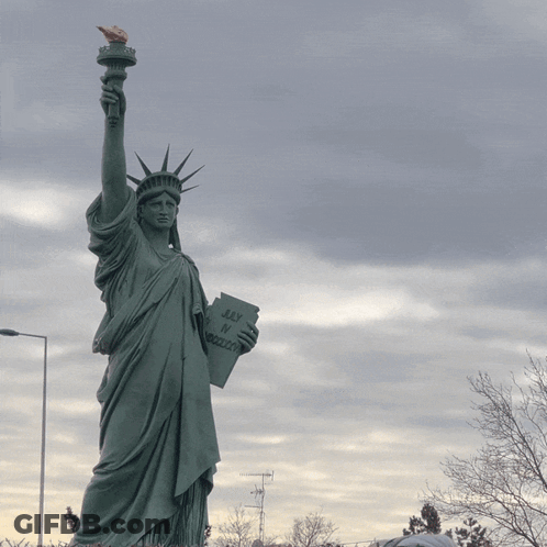 Statue Of Liberty Holding Book Saying Liberty Or Death GIF