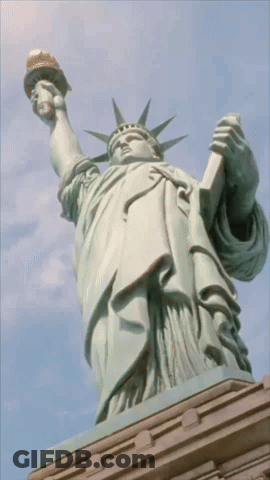 Statue Of Liberty Holding Torch And Book GIF