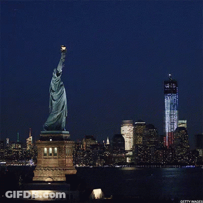 Statue Of Liberty In Front Of Twin Towers GIF