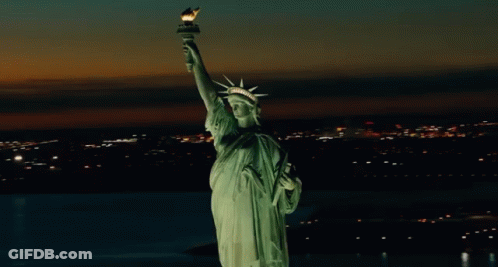 Statue Of Liberty Lit Up At Night GIF