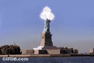 Statue Of Liberty Surrounded By Water And Cloud GIF