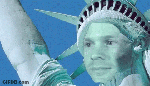 Statue Of Liberty With Man's Face Painted On It GIF