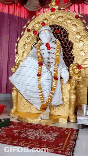 Statue Of Man On Gold Throne GIF