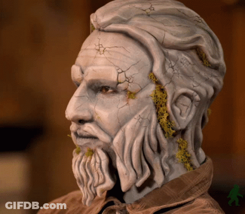 Statue Of Man With Beard And Cracked Face GIF