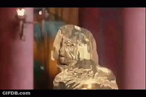 Statue Of Man With Beard Covered In Ice GIF