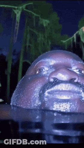 Statue Of Man With Beard Floating In Water GIF