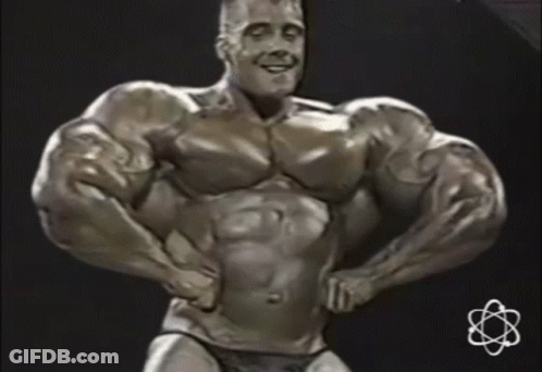Statue Of Man With Huge Muscles And Small Atom GIF