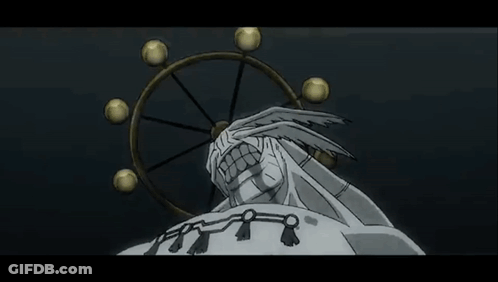Statue Of Man With Large Mouth In Front Of Spinning Wheel GIF