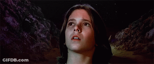 Statue Of Naked Woman With Necklace In Dark Room GIF