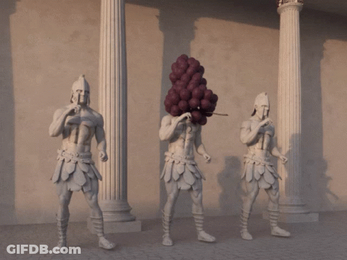 Statue Of Three Men With Grapes On Heads GIF