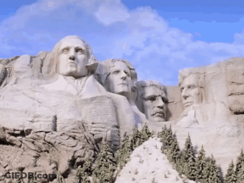 Statue Of US Presidents On Mountain GIF
