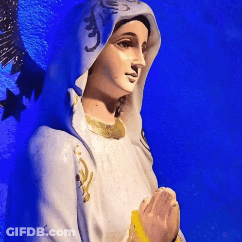 Statue Of Woman In White Robe And Blue Cape GIF