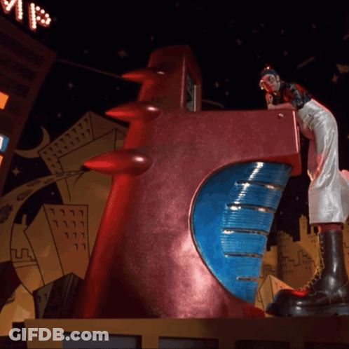 Statue Of Woman On Red Object With Blue Circle GIF
