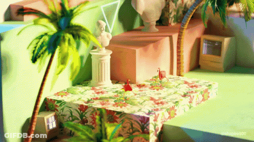 Statue Of Woman Sitting On Table With Palm Tree GIF