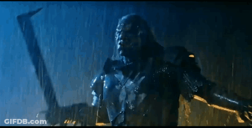 Statue Standing In Rain With Arm Outstretched GIF