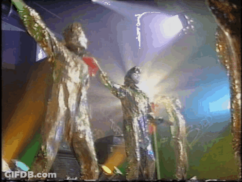 Statue With Red Heart On Chest On Stage GIF