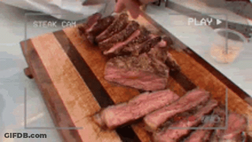 Steak Being Sliced On Wooden Board GIF