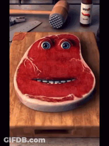 Steak With Face On Cutting Board GIF