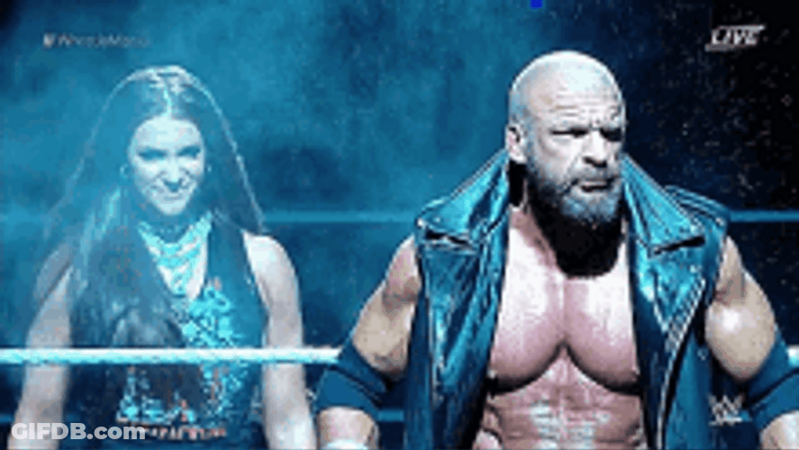 Stephanie Mcmahon Standing Beside A Man GIF