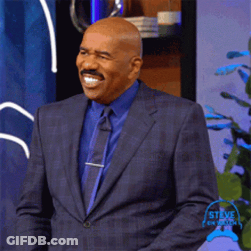 Steve Harvey Smiling In Suit And Tie GIF