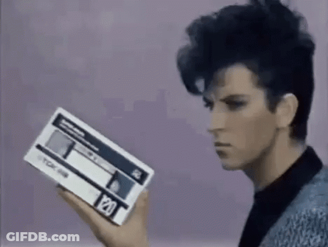 Steve Strange Holding A Vhs Tape Loop GIF