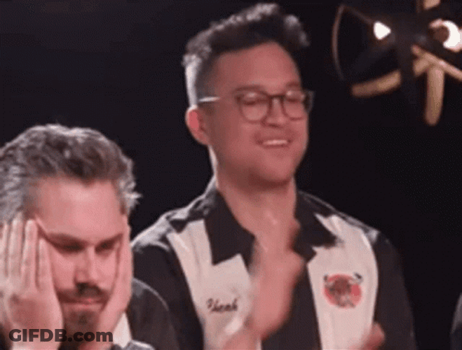 Steven Cheah Doing Hook Em Sign And Smiling GIF
