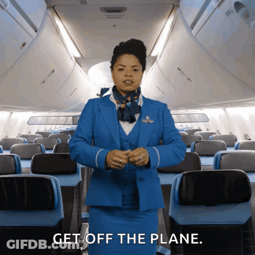 Stewardess In Blue Suit Telling Passengers To Get Off GIF