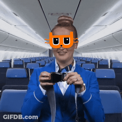 Stewardess In Cat Mask Taking Selfie GIF