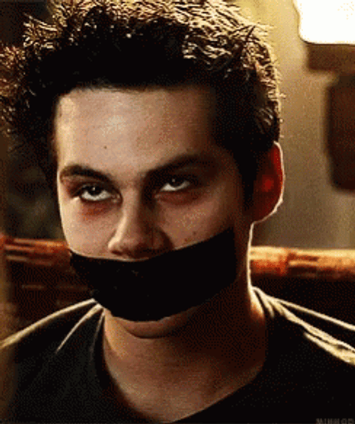 Stiles Stilinski With Covered Mouth GIF